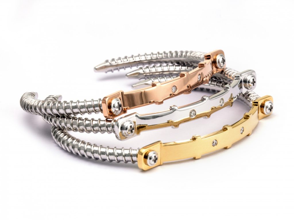 Three Wazna Strength of Spirit screw bangles in white, rose and yellow gold