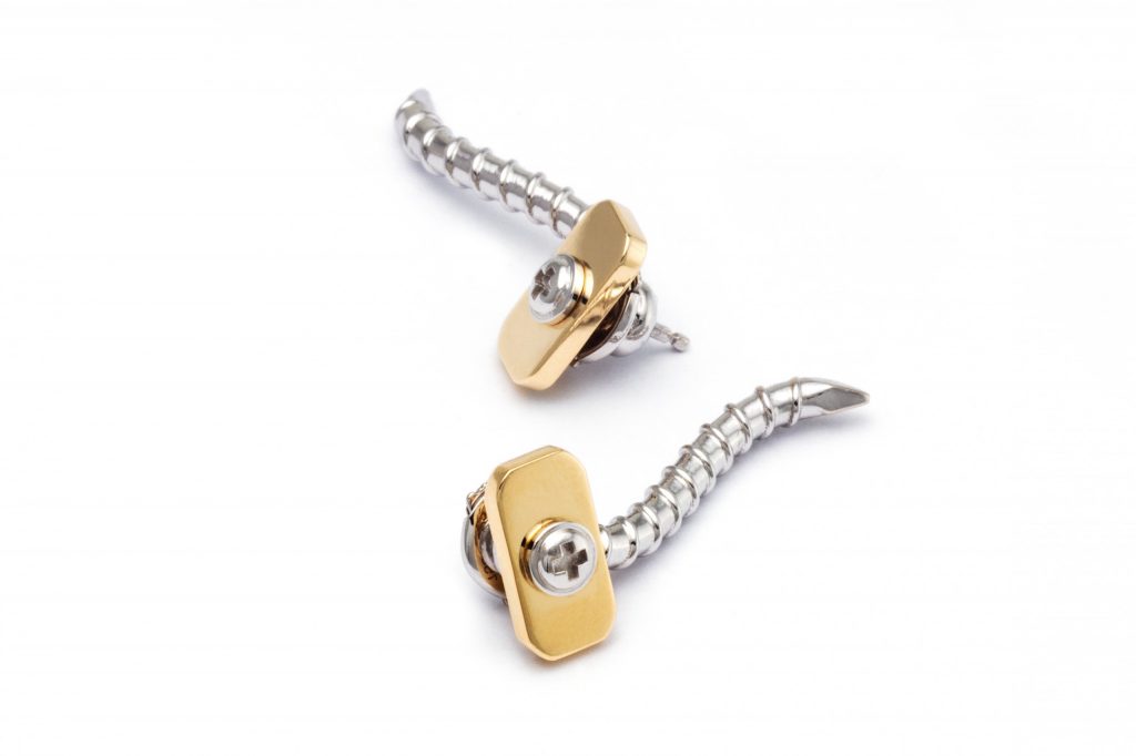Pair of Wazna Strength of Spirit screw earrings in white and yellow gold