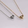 Fashion jewellery heart shape pendant with a shiny white stone